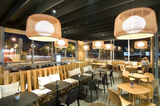  St Helier’s Bay Café & Bistro in Auckland improved the level of acoustical comfort for customers by discreetly installing baffle beams to the ceiling, wrapped in pre-coated black sonatex to blend in, and add a modern touch to the interior. (Image supplied by Asona Ltd.)