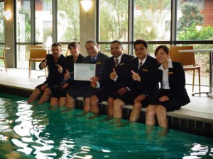 Staff at Sudima Auckland Airport celebrate their carbon zero certification.